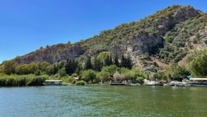 iew of Dalyan rock tombs across the river at golden hour