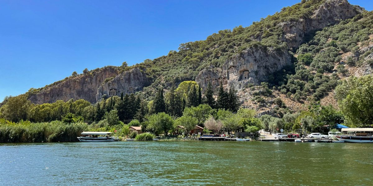 iew of Dalyan rock tombs across the river at golden hour